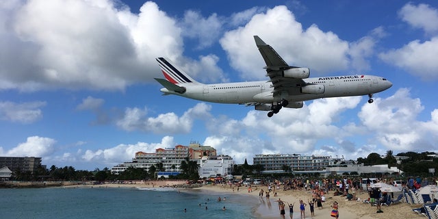 Air France Airbus A340-300 jet lands at SXM airport.