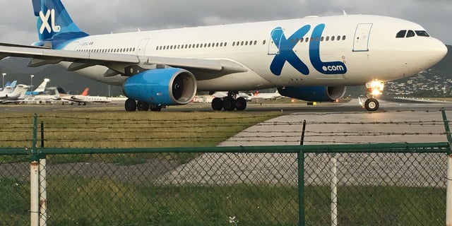XL Airlines A330-200 jet taxies at SXM Airport – flies from Paris CDG to SXM one time a week.