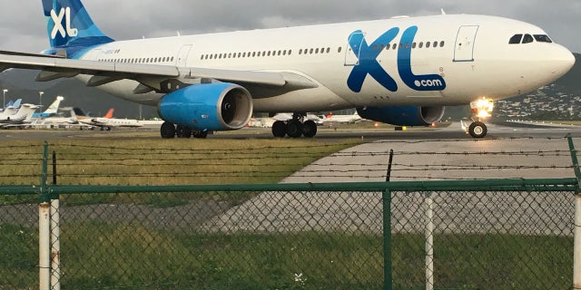 XL Airlines A330-200 jet taxies at SXM Airport – flies from Paris CDG to SXM one time a week.