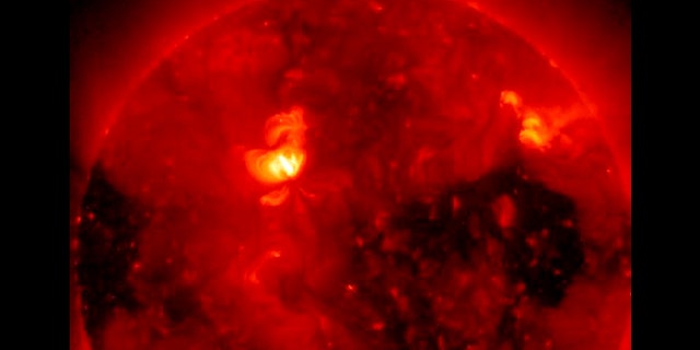 On Feb. 1, 2011, the Hinode satellite captured this breathtaking image of a coronal hole, the dark area seen at the right side of this image. A second, polar coronal hole can also be seen at left.