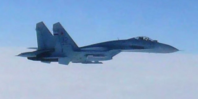 Feb. 7, 2013: In this photo taken by Japan Air Self-Defense Force and released by the Joint Staff Office of the Defense Ministry of Japan, a Russian fighter jet SU-27 flies over the sea off the Japanese island of Hokkaido Thursday afternoon. The Defense Ministry said two SU-27 jets, including the one shown in this photo, briefly intruded into Japanese airspace in the afternoon off the coast of Rishiri island on Hokkaido's west coast, prompting Japans air force to scramble jets.