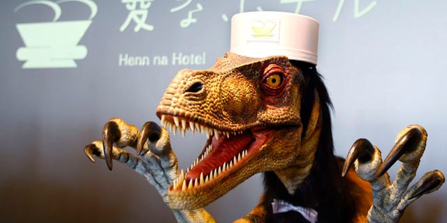 A receptionist dinosaur robot performs at a new hotel, aptly called Henn na Hotel or Weird Hotel, in Sasebo, southwestern Japan.