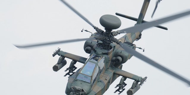 A photo provided by Japan's Ground Self-Defense Force shows an AH-64D helicopter, the same model as the one that crashed in Japan.