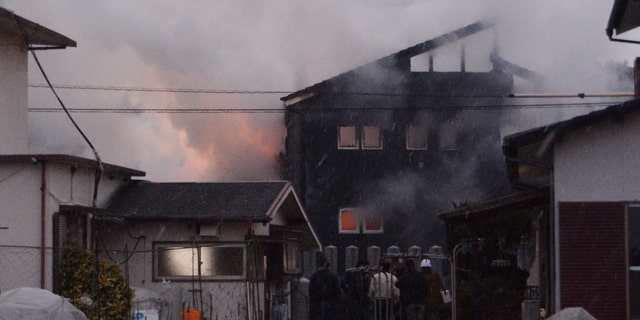 Smoke billows from the site where a Japanese military helicopter crashed in Kanzaki on Monday.