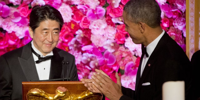 Apr. 28, 2015: President Barack Obama introduces Japanese Prime Minister Shinzo Abe, left, as he host him and Abe's wife Akie Abe, right, at the State Dinner at the White House in Washington.