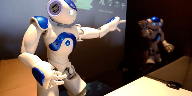 A receptionist robot performs during a demonstration for the media at the new hotel, aptly called Henn na Hotel or Weird Hotel, in Sasebo, southwestern Japan, Wednesday, July 15, 2015. From the receptionist that does the check-in and check-out to the porter thats a stand-on-wheels taking luggage up to the room, the hotel, that is run as part of Huis Ten Bosch amusement park, is manned almost totally by robots to save labor costs. (AP Photo/Shizuo Kambayashi)