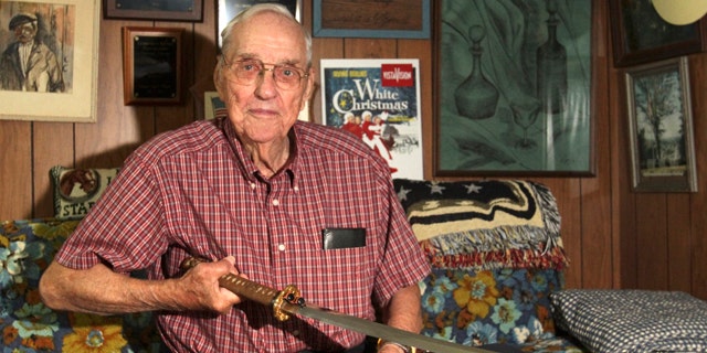Sept. 10, 2013: Orval Amdahl, 94, of Lanesboro, Minn, holds a sword he took from Japan when he was a captain in the Marines in 1945, at his home in Lanesboro, Minn.