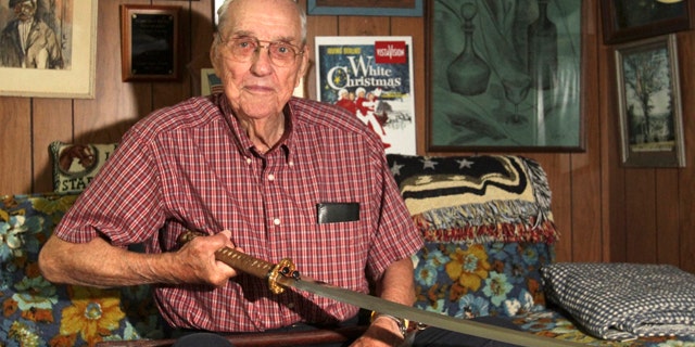 Sept. 10, 2013: Orval Amdahl, 94, of Lanesboro, Minn, holds a sword he took from Japan when he was a captain in the Marines in 1945, at his home in Lanesboro, Minn.