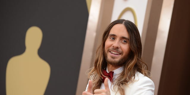 Jared Leto arrives at the Oscars on Sunday, March 2, 2014, at the Dolby Theatre in Los Angeles.  (Photo by Jordan Strauss/Invision/AP)