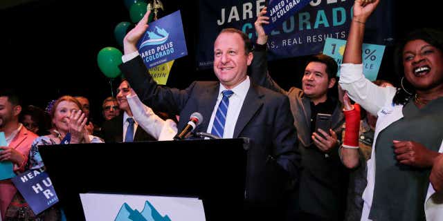 U.S. Rep Jared Polis waves to the crowd while accepting the Democratic nomination for the Colorado governor's race at an election night rally in Broomfield, Colo. , June 26, 2018.