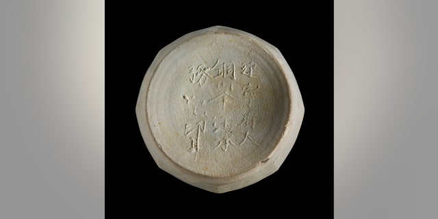 An inscribed piece of pottery recovered from the shipwreck site