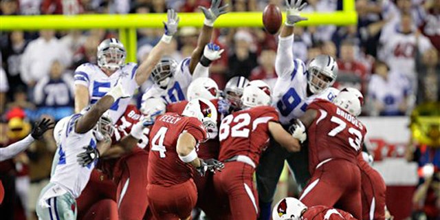 Arizona Cardinals place kicker Jay Feely (4) kicks the game winning field goal during the fourth quarter of an NFL football game Saturday, Dec. 25, 2010, in Glendale, Ariz. The Cardinals won 27-26.(AP Photo/Matt York)