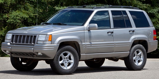 This undated photo provided by Chrysler shows a 1998 Jeep Grand Cherokee. The National Highway Traffic Safety Administration says on its website that it has added Jeep Liberty and Cherokee SUVs to the investigation. The probe now covers 5.1 million vehicles. The agency says 15 people have died in 26 Grand Cherokee fires. The investigation affects 1993 to 2004 Grand Cherokees. Also covered are 1993-2001 Cherokees and 2002-2007 Liberty's. (AP Photo/Chrysler)