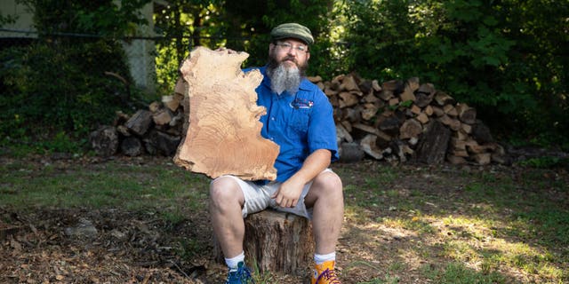 Jeff Thornton was fined $1,000 and threatened with an arrest warrant because he had a "disorganized" pile of wood in his backyard.