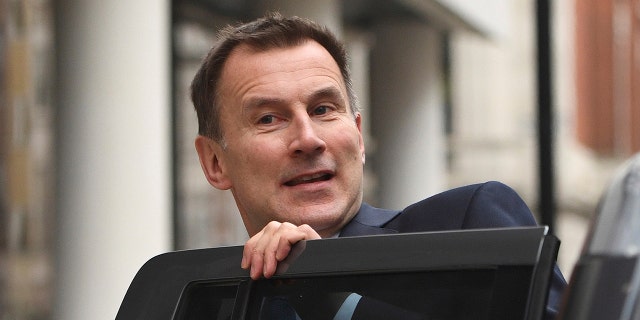 Britain's Health Secretary Jeremy Hunt in London Wednesday Jan. 3, 2018, after he apologized to patients who have had operations delayed as a result of winter pressures in the National Health Service.