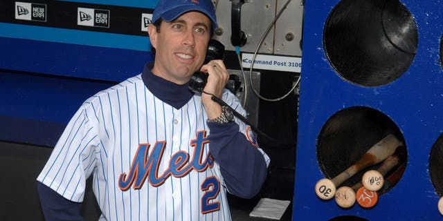 Jerry Seinfeld during Jerry Seinfeld Throws The First Pitch at The Mets/Yankees Subway Series Game to Promote The Release of the "Seinfeld" Season 4 DVD at Shea Stadium in New York City, New York, United States. (Photo by Stephen Lovekin/WireImage)