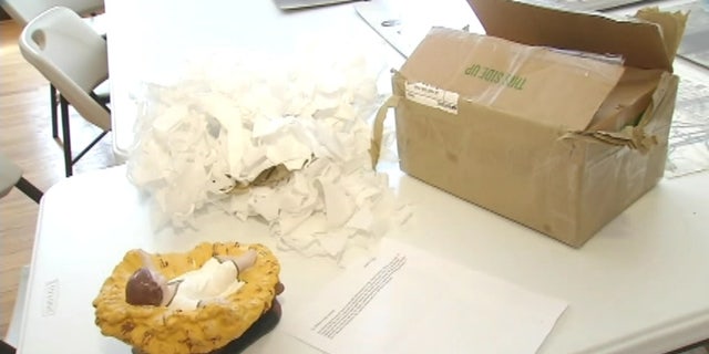 The statue was sent in a box with a note explaining how the sender received it.