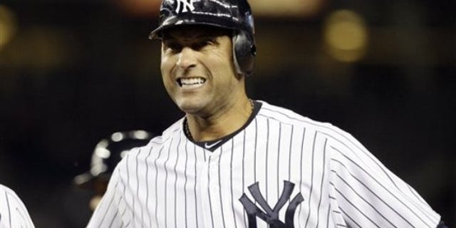 New York Yankees' Derek Jeter (2) reacts after hitting a fly-out during the fourth inning of a baseball game against the Minnesota Twins at Yankee Stadium in New York, Wednesday, April 18, 2012.
