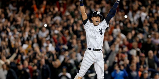 Sept. 25, 2014: New York Yankees' Derek Jeter jumps after hitting the game-winning single against the Baltimore Orioles in the ninth inning of a baseball game in New York. (AP)