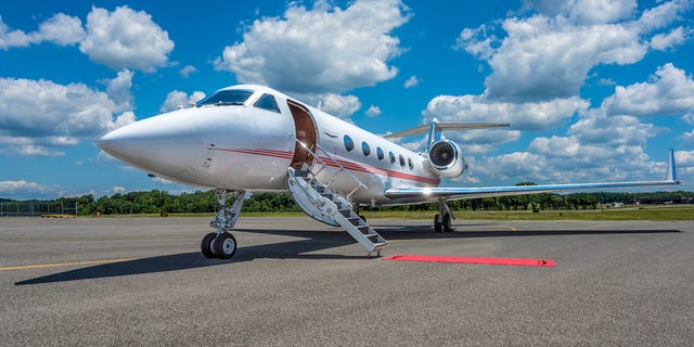 The DJ “started throwing items at passengers, walking back and forth, pounding on windows, banging his head on walls and insisting that the plane land immediately," according to reports.