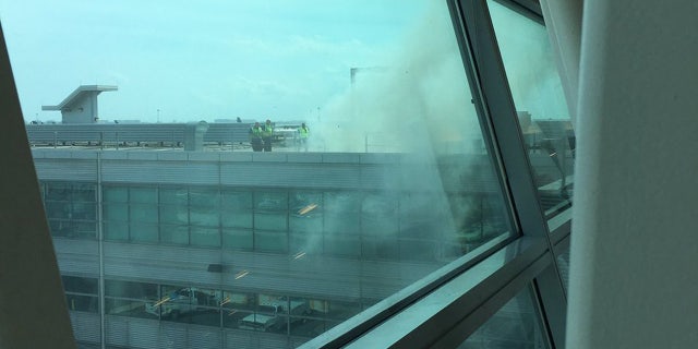 A restaurant fire at John F. Kennedy Airport in New York filled Terminal 4 with smoke.