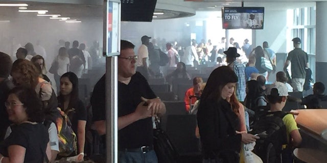 A restaurant fire at John F. Kennedy Airport in New York filled Terminal 4 with smoke.