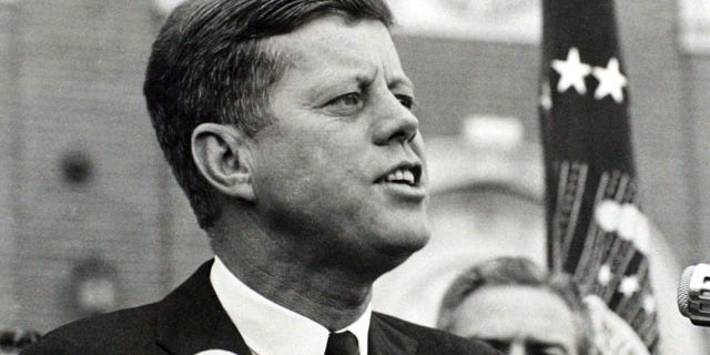 President John F. Kennedy delivers a speech at a rally in Fort Worth, Texas several hours before his assassination.