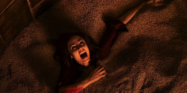 This image released by Lionsgate shows Laura Vandervoort in the horror film, "Jigsaw." (Brooke Palmer/Lionsgate via AP)