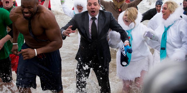 March 2, 2014. "The Tonight Show" host Jimmy Fallon, center, exits the water during the Chicago Polar Plunge. Fallon joined Chicago Mayor Rahm Emanuel in the event.