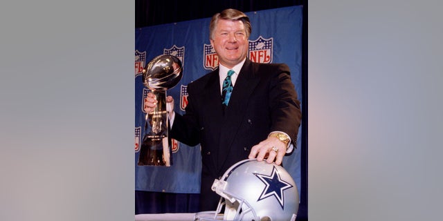 Coach Jimmy Johnson holds the Lombardi Trophy after the Dallas Cowboys won Super Bowl XXVIII.