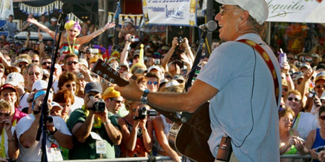 Singer Jimmy Buffett makes a surprise appearance at the annual Parrot Heads in Paradise convention in Key West, Fla., Friday Nov. 1, 2002. More than 3,000 of the singer's fans have gathered in Key West through Sunday, Nov. 3. There are now almost 160 Parrot Head chapters in the U.S., Australia and Canada with more than 18,000 total members. (AP Photo/Florida Keys News Bureau, Roberto Rodriguez)