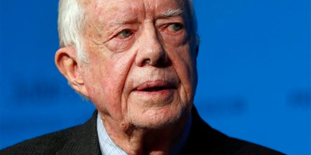 In this Thursday, Nov. 20, 2014 photo, former U.S. President Jimmy Carter speaks during a forum in Boston. On Wednesday, Aug. 12, 2015, Carter announced he has cancer and will undergo treatment at an Atlanta hospital. (AP Photo/Elise Amendola)