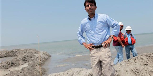 Louisiana Gov. Bobby Jindal looks over the berm system on the northern end of the Chandeleur Islands, La., July 15. (AP Photo)