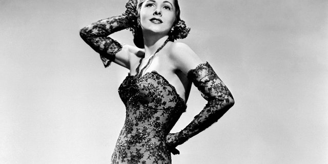 File- This April 1945 file photo shows actress Joan Fontaine wearing a gown.