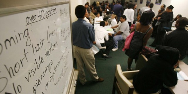 Applicants wait at a job fair in Los Angeles Nov. 20. (Reuters Photo)