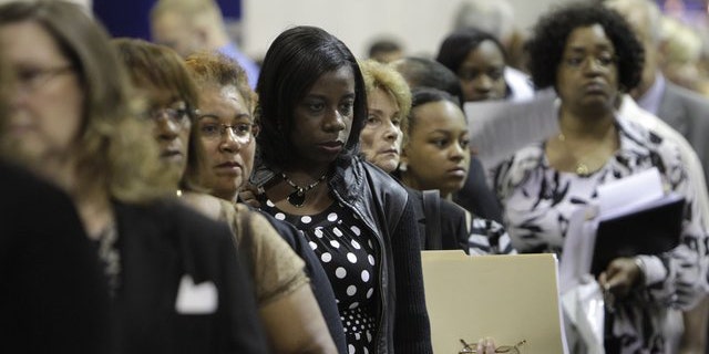 Aug. 25, 2010: Job seekers stand in line at a job fair outside Detroit.