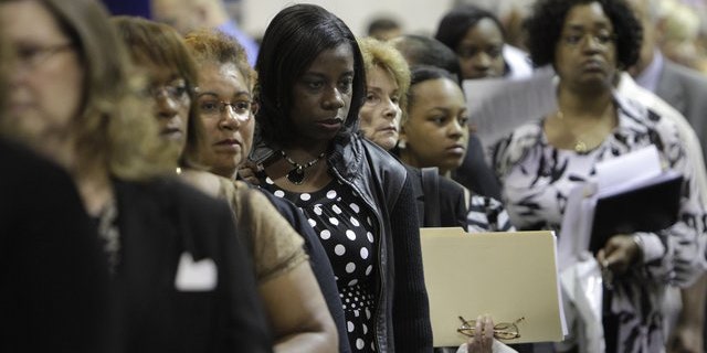 Aug. 25, 2010: Job seekers stand in line at a job fair outside Detroit.