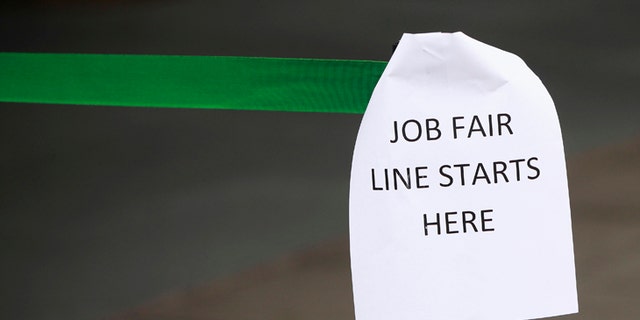 File photo - A sign marks the entrance to a job fair in New York October 24, 2011. (REUTERS/Shannon Stapleton)