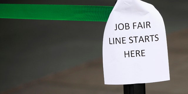 File photo - A sign marks the entrance to a job fair in New York October 24, 2011. (REUTERS/Shannon Stapleton)