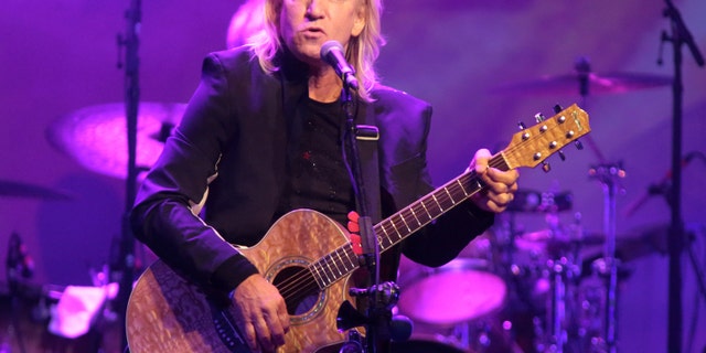 FILE - In this Oct. 12, 2015 file photo, Joe Walsh of the band The Eagles performs in a solo concert at The Fillmore in Philadelphia. Eagles keyboardist and guitarist Walsh says hes pulling out of a Cleveland summer concert he thought would be a nonpartisan event for veterans families because its actually a launch for the Republican National Convention. The concert is scheduled for July 18, 2016. (Photo by Owen Sweeney/Invision/AP, File)