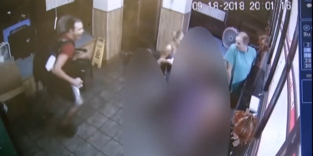 Surveillance video from the takeout restaurant showed shocked patrons attempting to save Martinez's life.