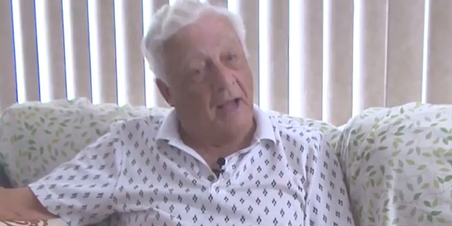 U.S. Navy veteran John Ackert said he's been ordered to take down the American flag wrap covering his mailbox.