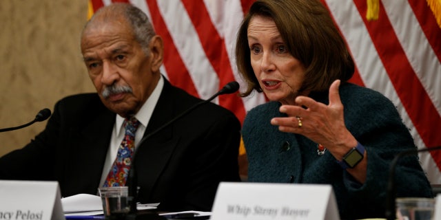 House Minority leader Nancy Pelosi and Rep. John Conyers take part in a discussion panel.