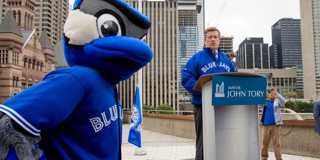 TORONTO, ON - OCTOBER 6 - Toronto Mayor John Tory held a special flag raising for the Toronto Blue Jays to kick of the 2015 post season. October 6, 2015. (Carlos Osorio/Toronto Star via Getty Images)