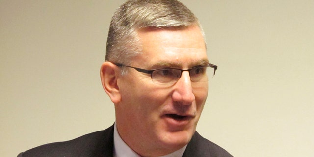 In this Jan. 26, 2014 file photo U.S. Sen. John Walsh speaks to reporters in Helena, Mont.