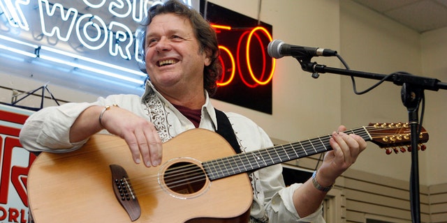 In this Thursday, April 17, 2008 file photo, John Wetton performs with the band Asia at a music store in New York.