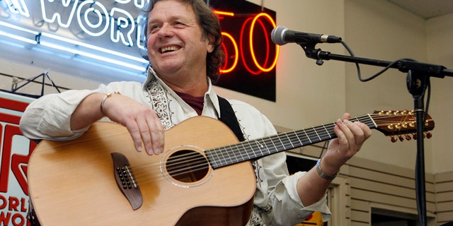In this Thursday, April 17, 2008 file photo, John Wetton performs with the band Asia at a music store in New York.