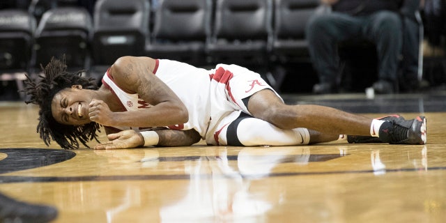 Alabama's John Petty reacts after suffering an ankle injury in the second half of Saturday's game.