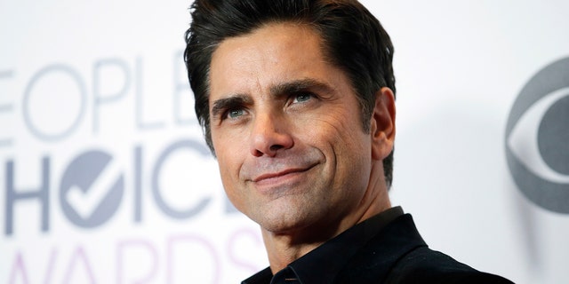 Actor John Stamos of "Grandfathered" poses backstage during the People's Choice Awards 2016 in Los Angeles, California January 6, 2016. REUTERS/Danny Moloshok - TB3EC170AP2NM