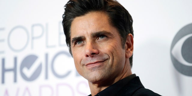 Actor John Stamos of "Grandfathered" poses backstage during the People's Choice Awards 2016 in Los Angeles, California January 6, 2016. REUTERS/Danny Moloshok - TB3EC170AP2NM